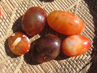 Polished Bright Red/ Orange Small to Medium Sized Carnelian Agate Palm Stones / Gallets - sold per kg - From Madagascar - TopRock