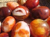 Polished Bright Red/ Orange Small to Medium Sized Carnelian Agate Palm Stones / Gallets - sold per kg - From Madagascar - TopRock