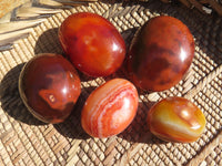 Polished Bright Red/ Orange Small to Medium Sized Carnelian Agate Palm Stones / Gallets - sold per kg - From Madagascar - TopRock