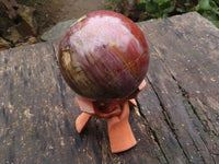 Polished Extra Large Petrified Red Podocarpus Wood Sphere & Rosewood Stand x 2 From Madagascar - TopRock