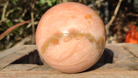 Polished Orange Twist Calcite Sphere  x 1 From Maevantanana, Madagascar